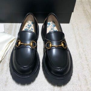 Gucci Black Leather Loafers with Gold Accents
